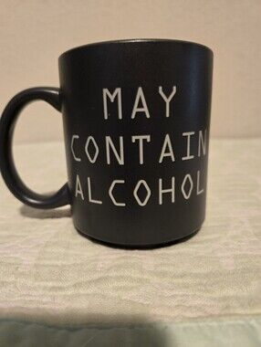 TYPO "May Contain Alcohol" Black Coffee Mug.